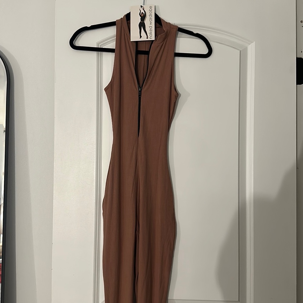 Brand new Brown jumpsuit with tag on. From naked wardrobe